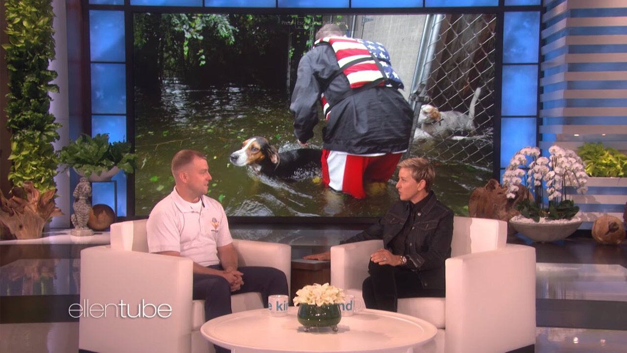 Ryan Nichols wading through floodwater on a search-and-rescue operation