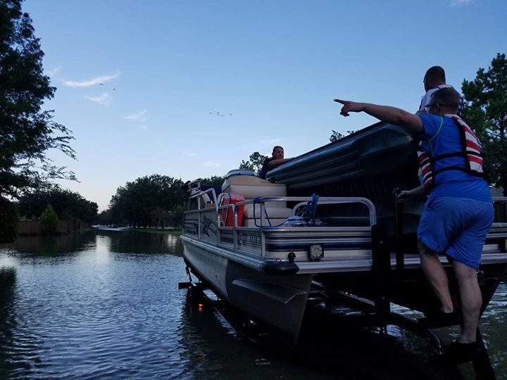 Ryan Nichols on a hurricane flood rescue, pulling people and pets to safety