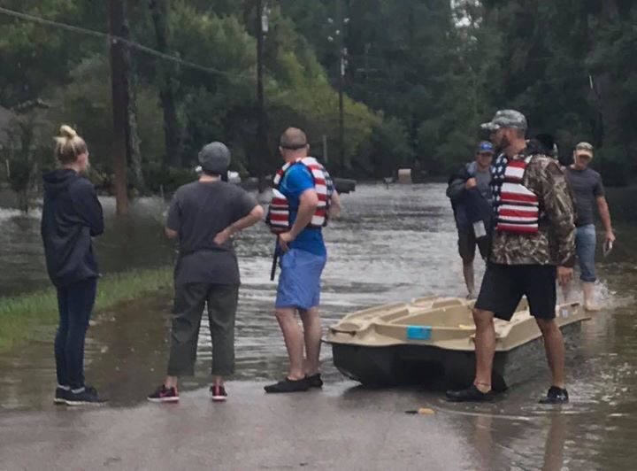Rescue the Universe volunteers evacuating families from rising floodwater