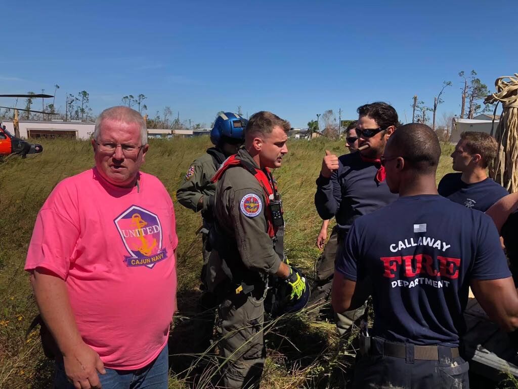 Disaster relief — Ryan Nichols delivering supplies to a flooded community