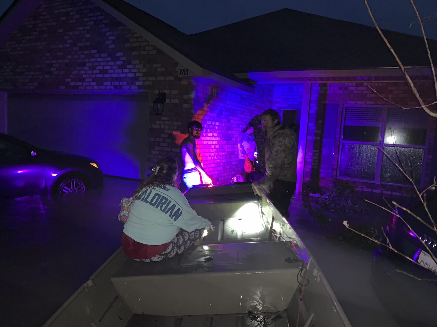Ryan Nichols pulling a stranded family out of hurricane floodwaters