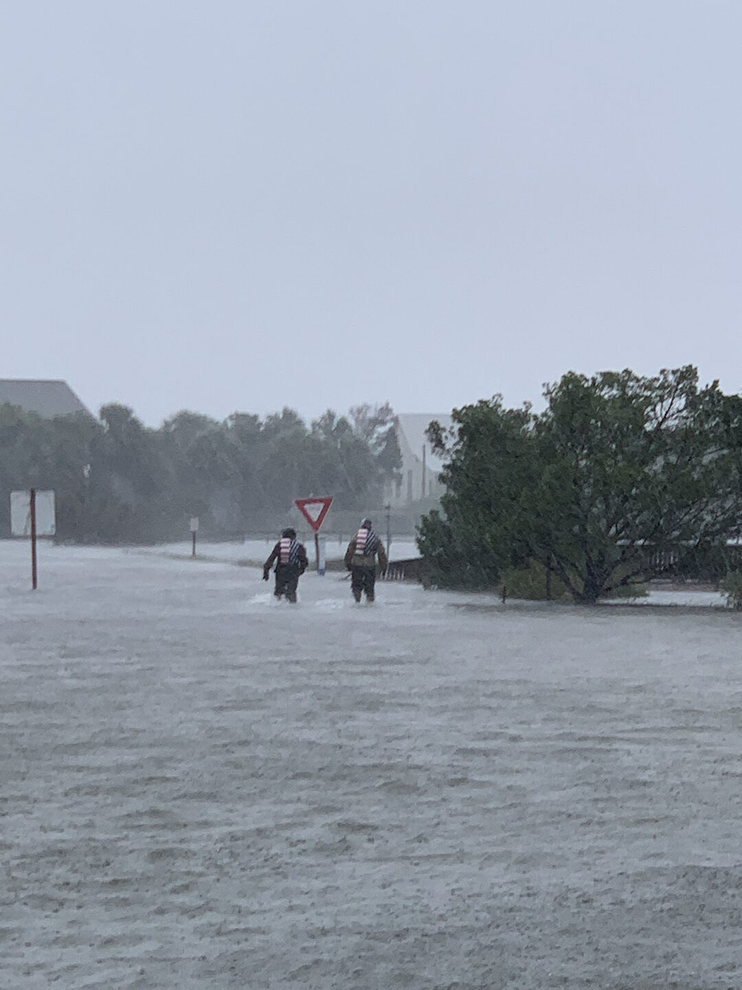 Ryan Nichols pulling a stranded family out of hurricane floodwaters