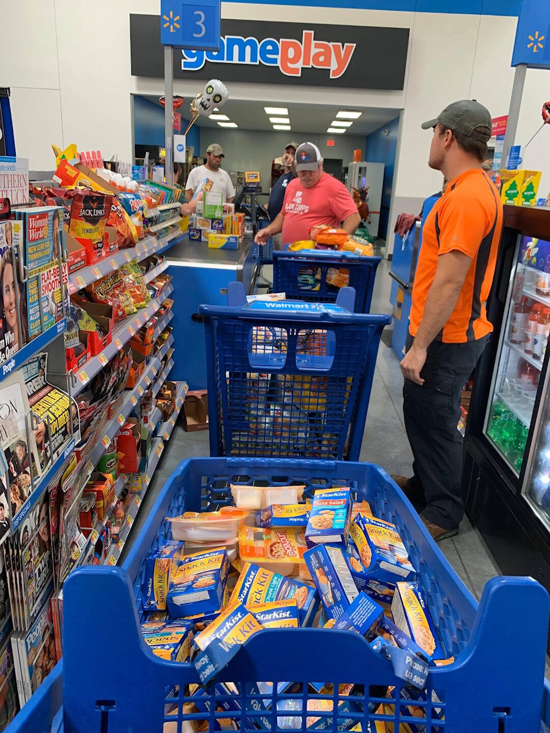 Ryan Nichols carrying flood victims to safety during a Texas hurricane rescue